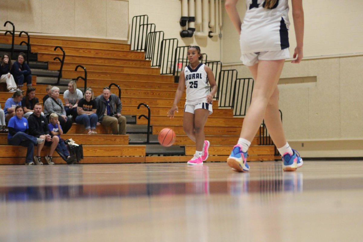 On Oct. 31, 7 grader Maci Cavitte dribbles the ball down the court after they scored against Emporia at WRMS.