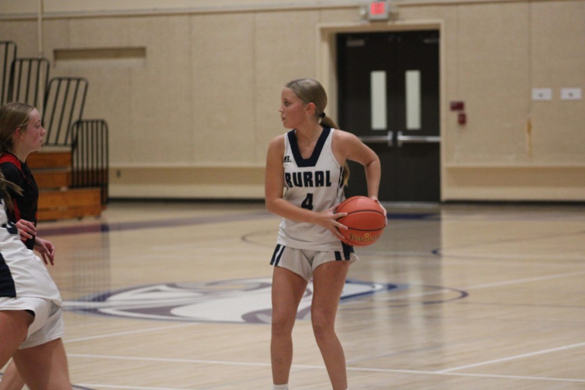 On Oct. 31, 7th grader Kinsley Roth catches the ball after her teammate passes to her while they play against Emporia at WRMS. 