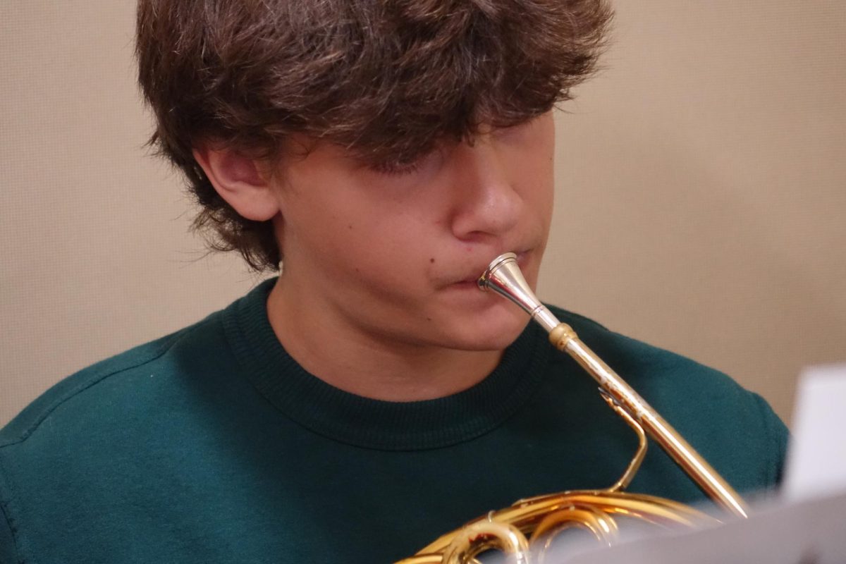 8th Grader Gibson Uhler plays his French horn during sectionals on Nov. 12.
