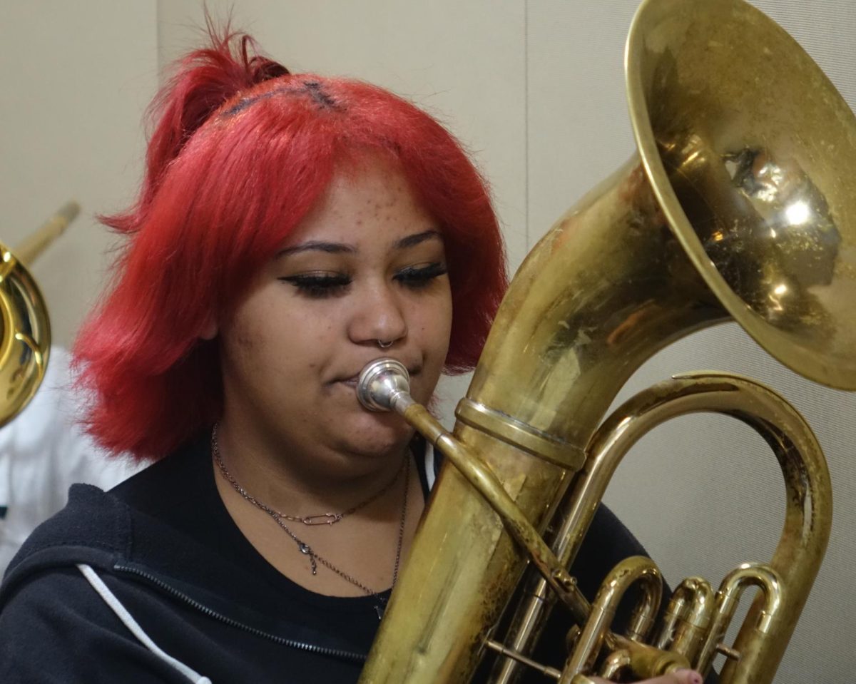 8th grader Taetum Johnson plays her baritone/ euphonium during sectionals on Nov. 12.
