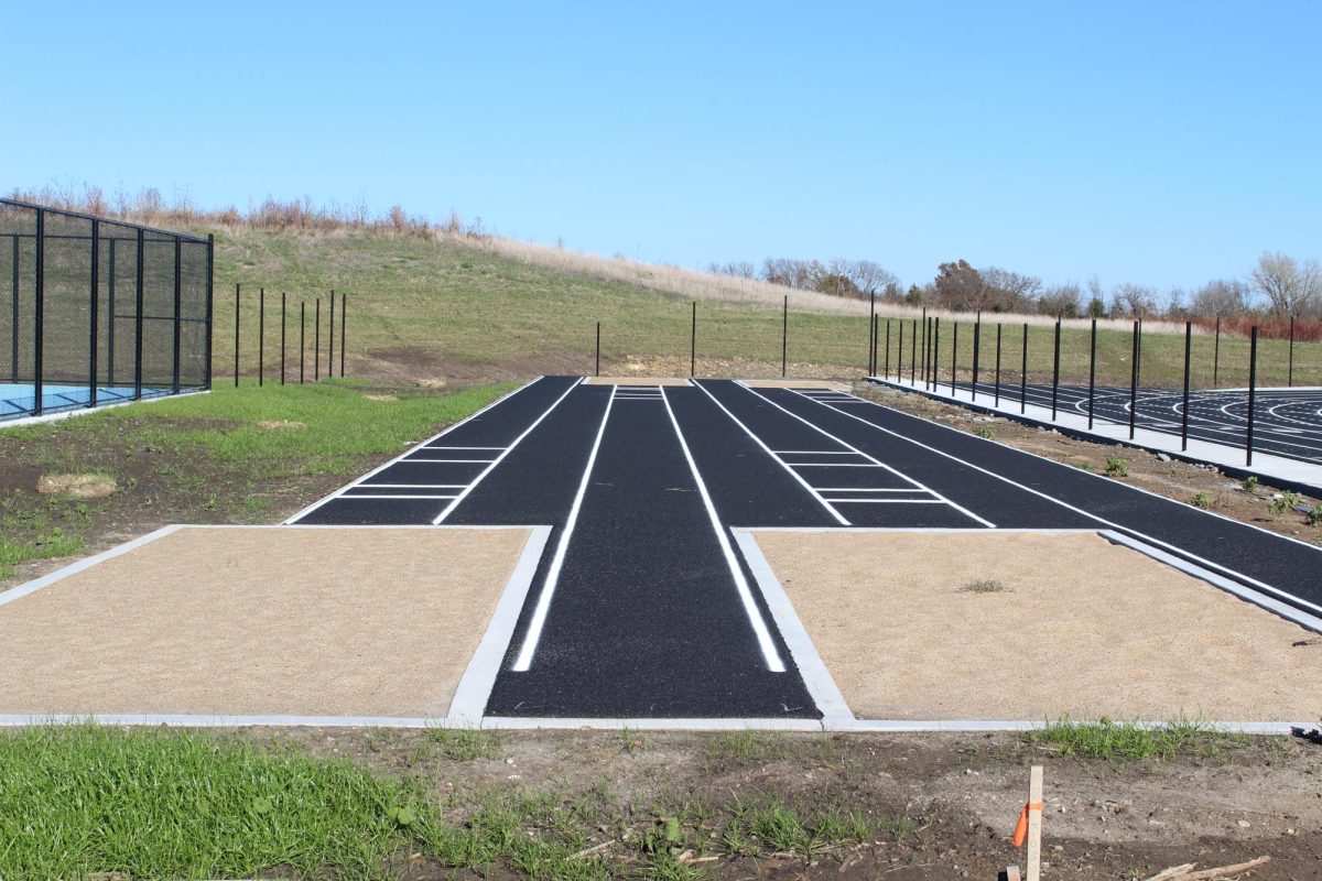 Long jump pits located between the tennis and football field.