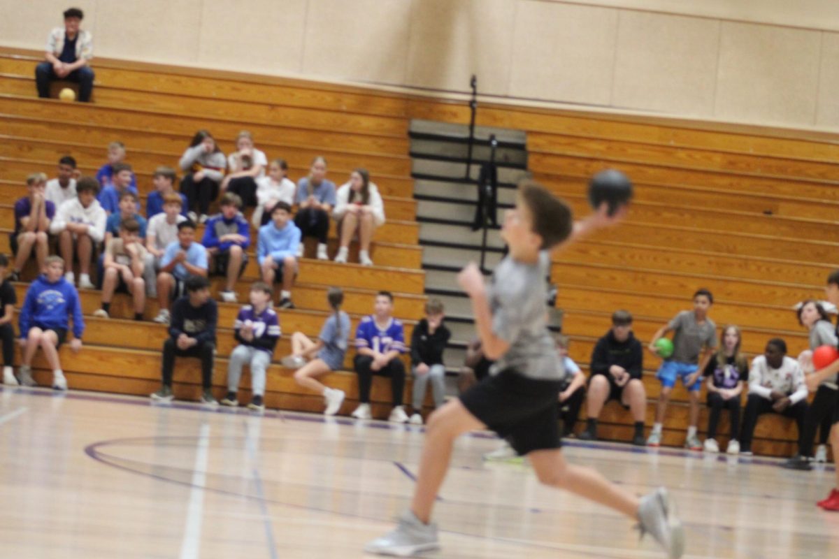 this 7th grader is about to throw the ball at the other team during the dodgeball tournament at WRMS on november 12.