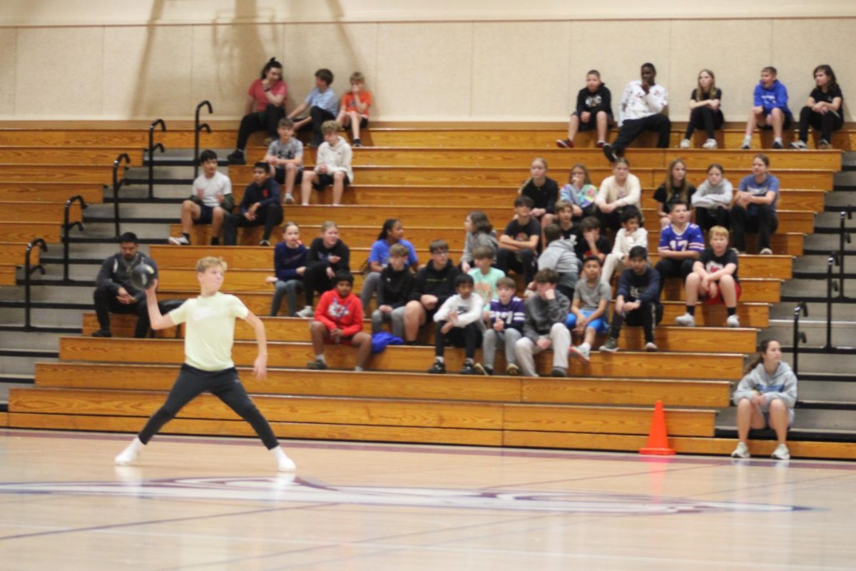 on November 12 at WRMS this 7th grader is about to throw the ball to get someone out and get closer to winning the round of dodgeball 