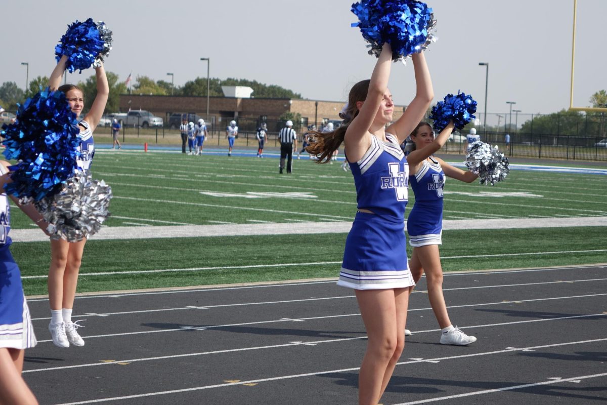 On Aug. 12, Emery Wishon, Hadley Rosenbaum, and Adele Smith do a sideline cheer to excite the crowd at the WRMS football game. 