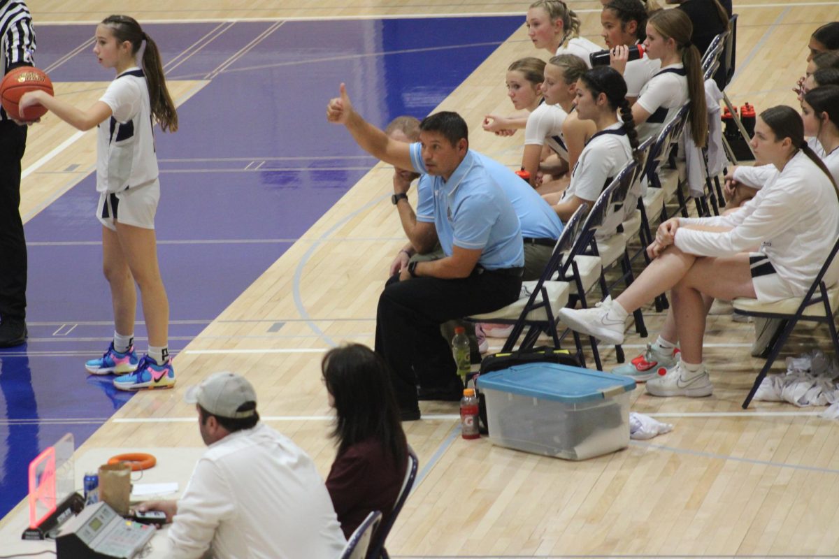 On Nov. 12, Coach C gives a thumbs up to one of the 8 grade player’s from the sidelines. Girl’s Basketball, Coach C said not only are they talented, but more importantly great young ladies to be around. “I get the opportunity to coach them in both 7th and 8th grade. They are a fun group of young ladies who are friends on and off the court” said Coach C. 