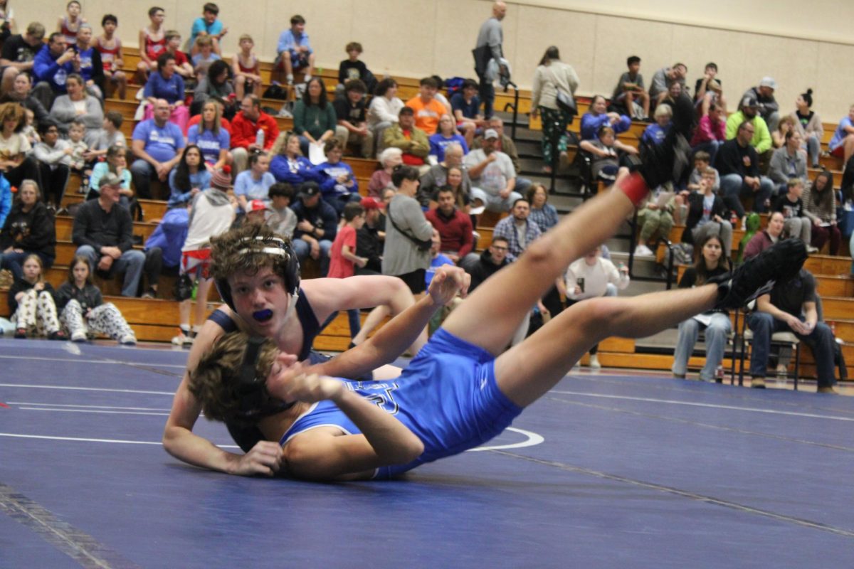 On Dec. 4, Porter Hamm throws a wrestler from Junction City “I do wrestling because wrestling is super cool and wrestling is good conditioning.”Hamm said.