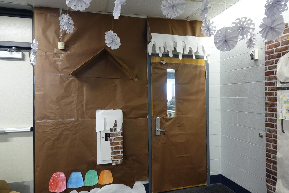 Mrs. Armstrong’s art classes decorate her door during their freetime in the eighth grade hallway to help her win the door decorating contest.
