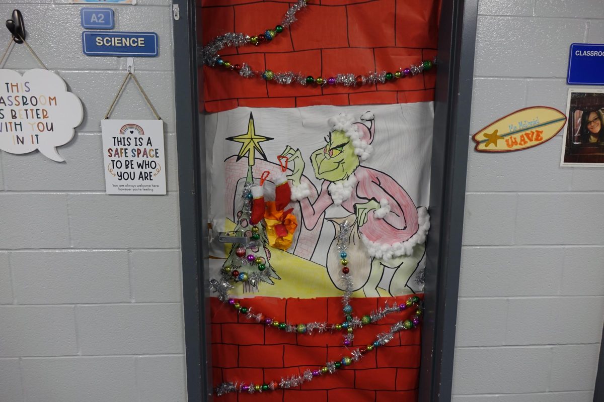 Mrs. Turner students decorate her door during school in the eighth grade hallway at WRMS. Mrs. Turner said she does not help her students decorate. “I bought some garland and cotton balls” (Turner). 
