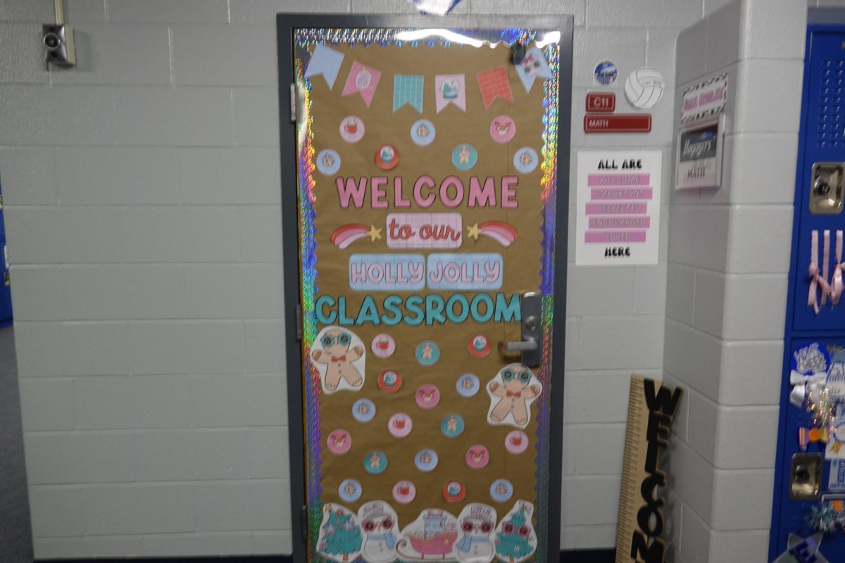 Ms. Henley’s students decorate her door during advisory in the voyagers pod to help her win the door decorating contest. Bacon said they win a prize. “They win pizza for their advisory” (Bacon). 
