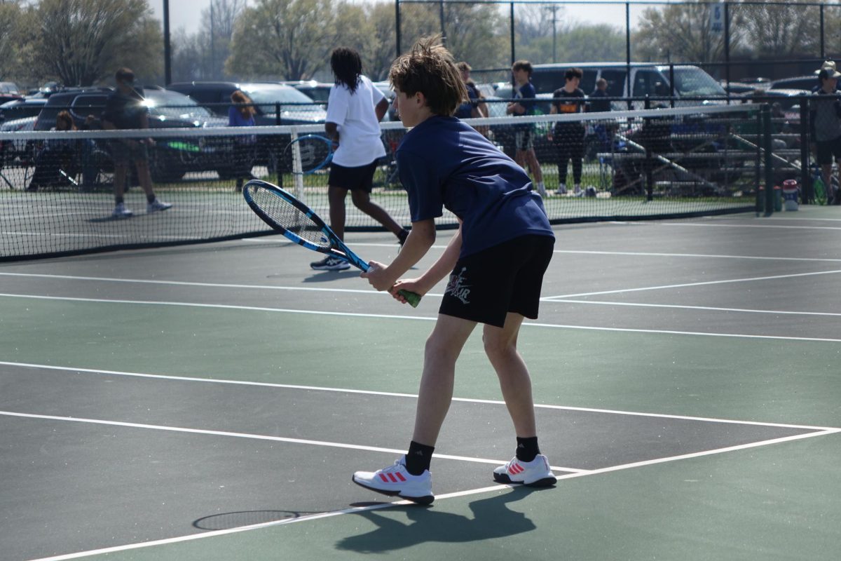 On April 8, seventh grader Truman Mays gets in ready position to receive a ball from his opponent in a match at WRHS.