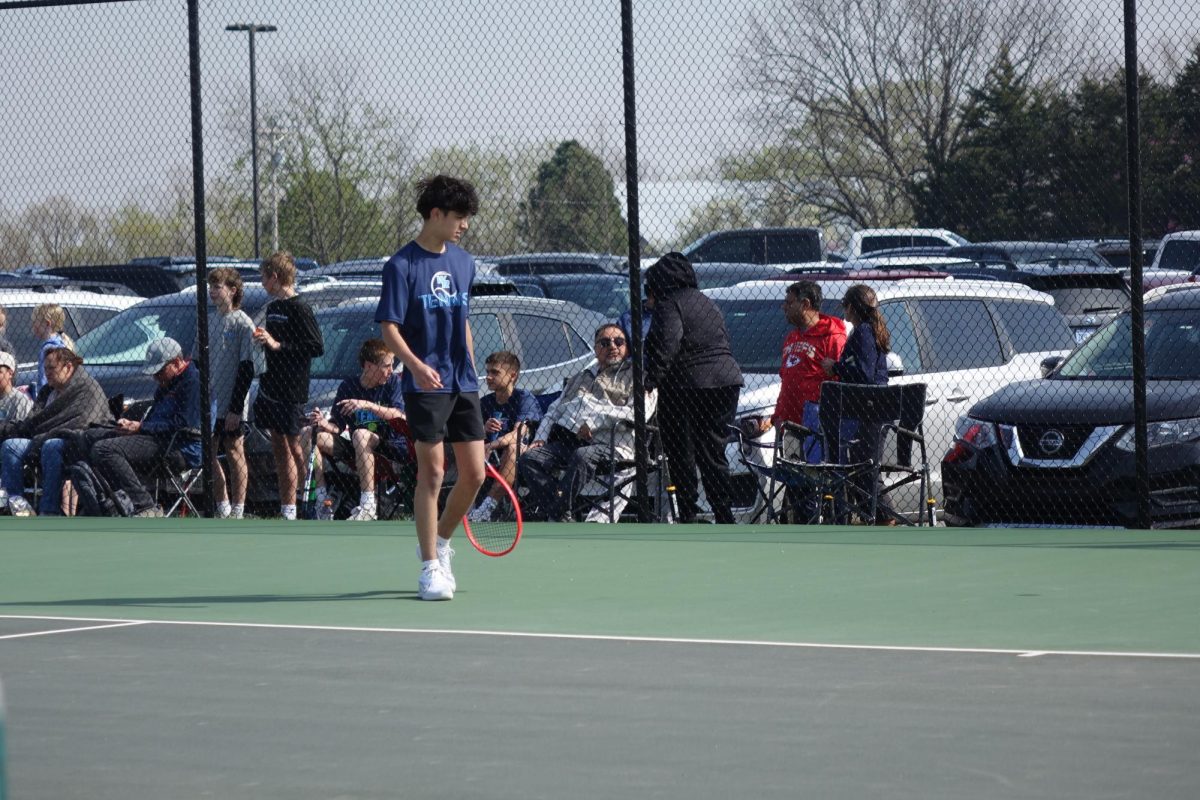 On April 8, eighth grader Ethan Katzer walks up to the service line to prepare to receive a serve for a meet at the WRHS tennis courts. He enjoys tennis and thinks its fun. “My favorite part about tennis is winning matches and tournaments,” Katzer said.