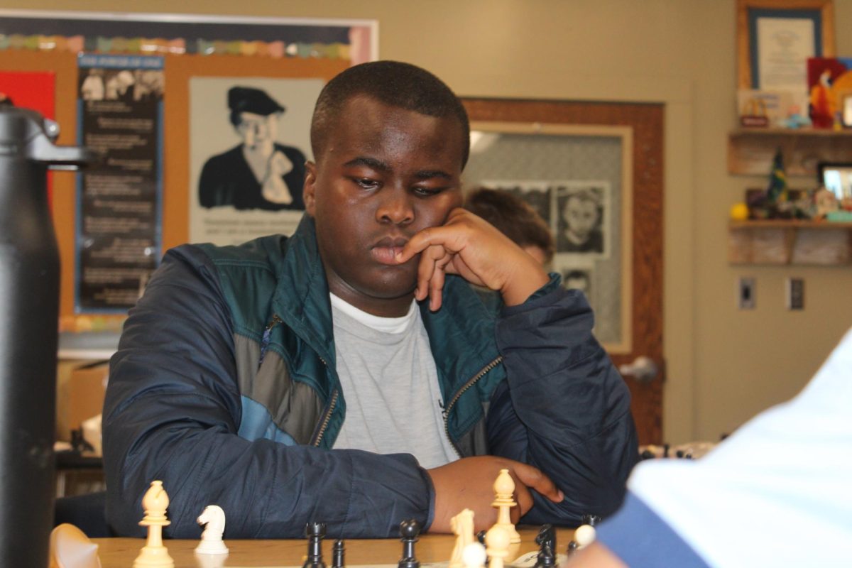 Seventh grader Braylon Gray plays chess in advisory in the WERC room on April 23. Gray says “I've been playing chess since kindergarten, so that would be around 7-8 years.”