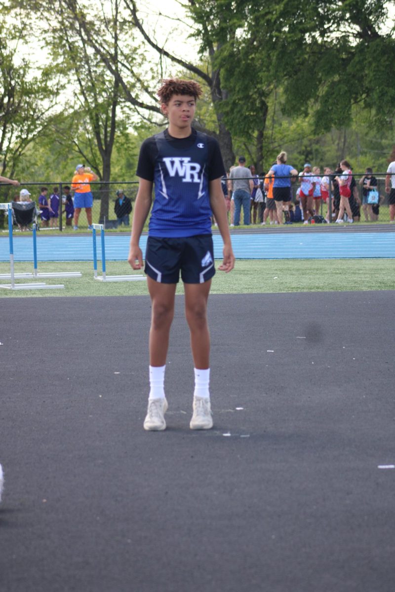 Eighth grader Drake Griffith is warming up at high jump for the relay meet on May fifth at WRHS track. He said, “I didn't do it last year, and I wanted to try it this year because I thought I would be good at it.” Drake participates in several events, including “long jump, high jump, and triple jump.”
