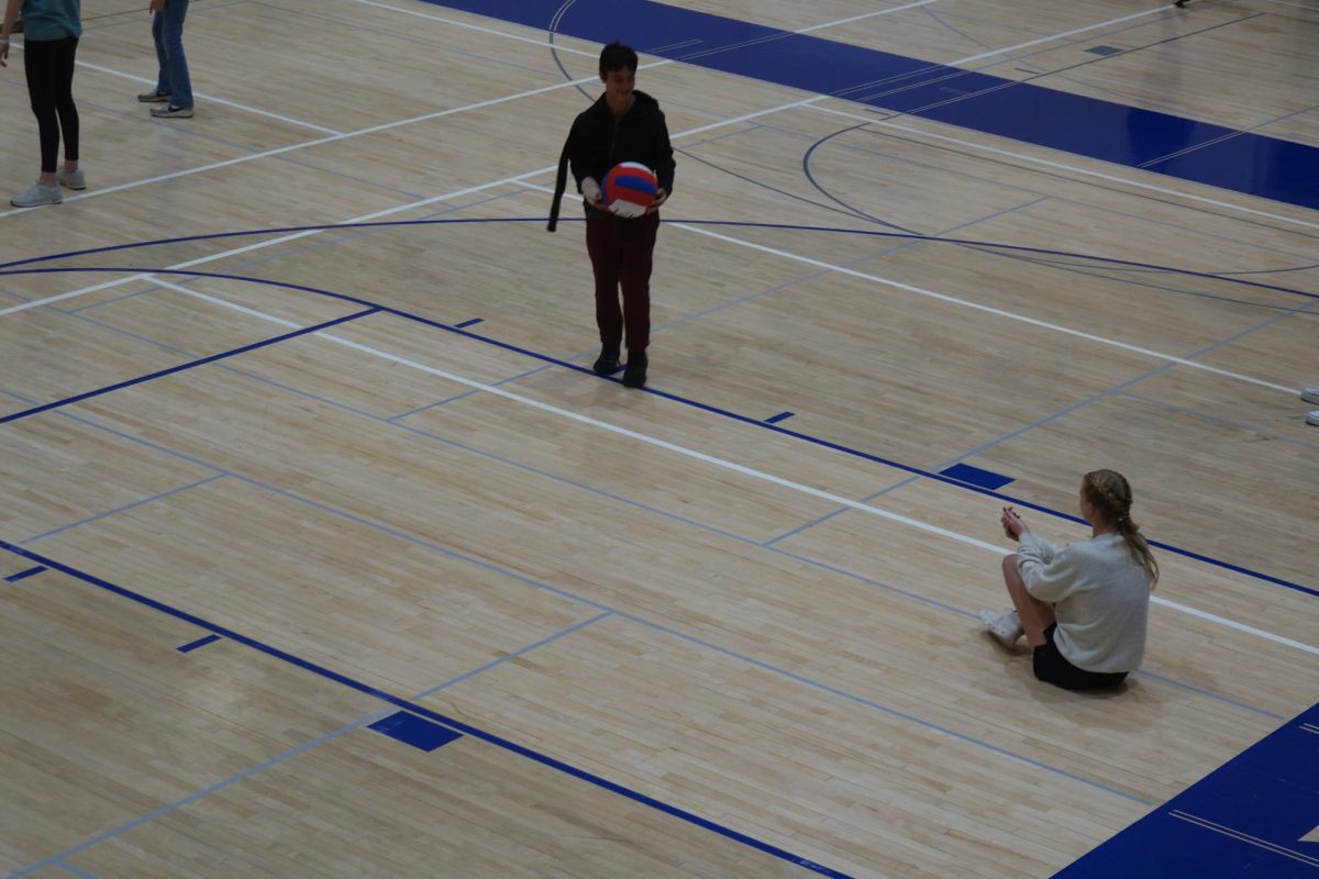 Eighth graders Reese Elliot and David Heider play volleyball at Wave Wednesday during advisory on April 30th in Gym A. Reese says “I like Wave Wednesdays because you get to do things with friends in advisory."
